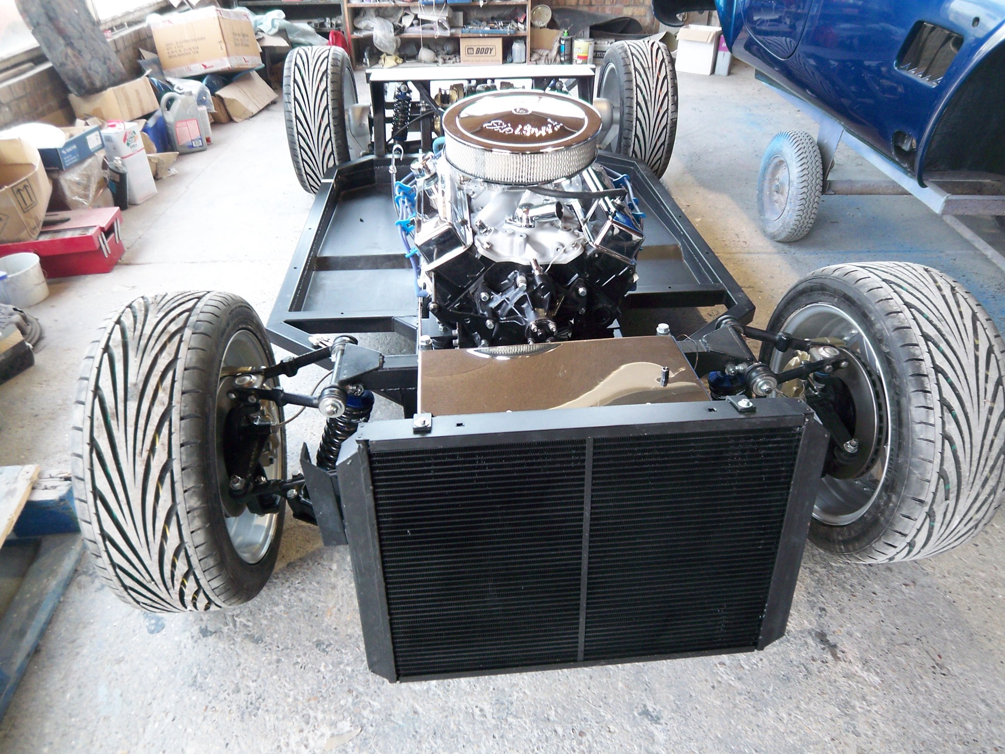 Cobra rolling chassis with engine fitted in the workshop