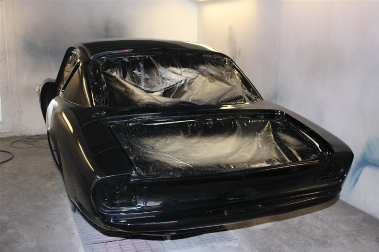 Lotus body freshly sprayed black in the booth