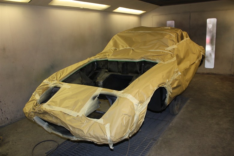 Lotus body masked up in the spray booth
